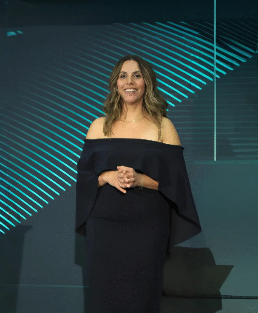 Ozge Fettahlioglu speaking at a wellness design and architecture event